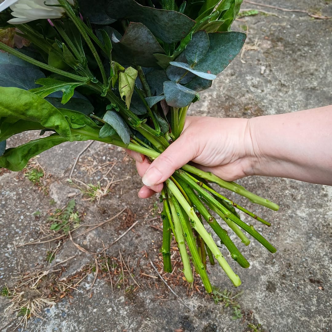Florist Holding Flowers for Hand Tied Bouquet